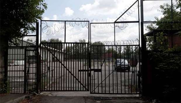 A US embassy car is seen through the gate at the entrance to its warehouse building in Moscow.