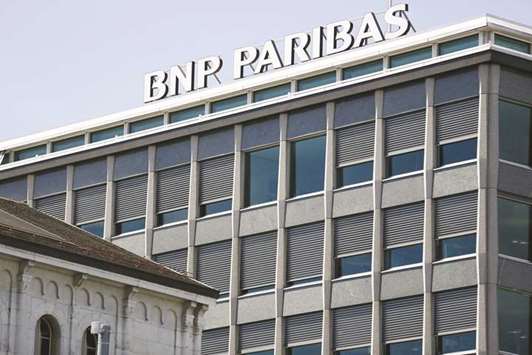A BNP Paribas sign is pictured on a building of the bank in Geneva. BNP Paribas, BlackRock, Man Group and Deutsche Bank are among many firms bolstering their quantitative operations by adding resources and personnel and finding new ways to incorporate computer models and data science into their research.