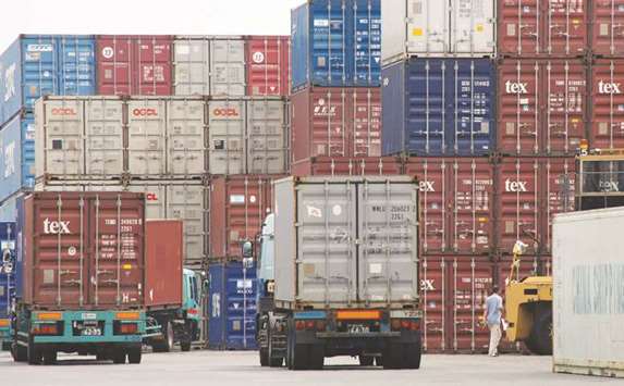 A labourer works in a container area at a port in Tokyo. The International Monetary Fundu2019s latest forecast published in July sees Japanu2019s economy growing 1.3% this year thanks to a continued pickup in trade and temporary fiscal support.