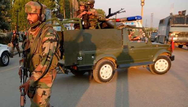Indian army personnel arrive at the site of attack