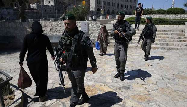 Israeli police walk outside Damascus Gate in Jerusalem's Old City