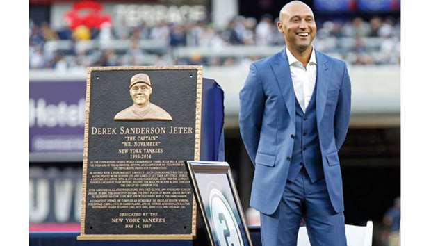 In this May 14, 2017, picture, former New York Yankees shortstop Derek Jeter laughs during a pre-game ceremony to retire his jersey number and unveil his monument park plaque before the game against the Houston Astros at Yankee Stadium in Bronx, New York. (USA TODAY Sports)