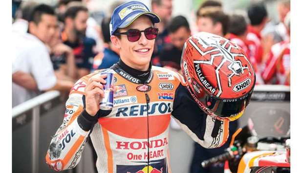 Repsol Hondau2019s Marc Marquez celebrates after racing to pole in the qualifying session for Austrian MotoGP at Red Bull Ring in Spielberg, Austria, yesterday. (AFP)
