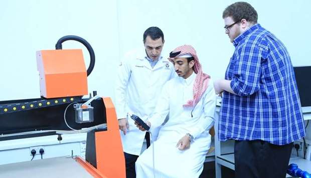 Participants learn to operate equipment during the workshop.