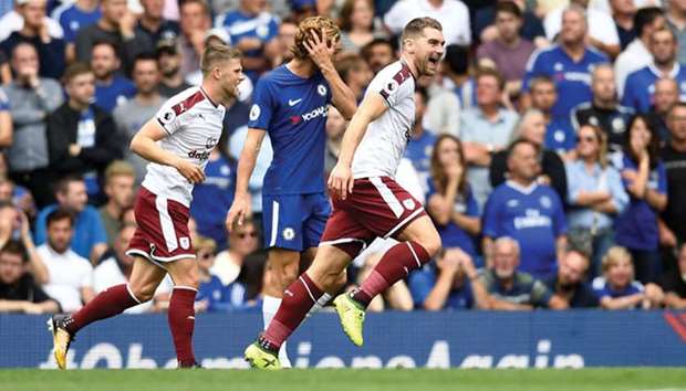 Burnleyu2019s Sam Vokes celebrates scoring against defending champions Chelsea during their English Premier League encounter yesterday at Stamford Bridge.