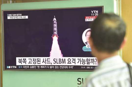 An August 25, 2016, file photo of a man at a railway station in Seoul watching a television screen reporting news of North Koreau2019s submarine-launched ballistic missile test.