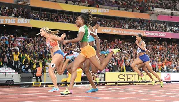 Dafne Schippers (left) of the Netherlands crosses the finish line to win the womenu2019s 200m final at the 2017 IAAF World Championships in London on Thursday. (AFP)