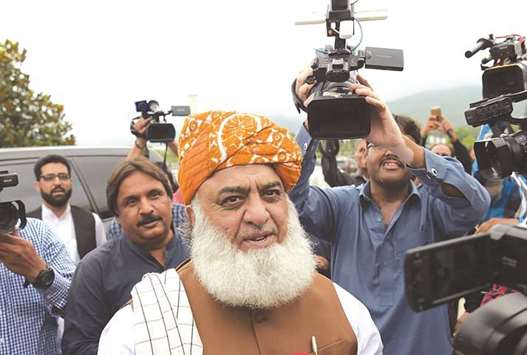 Leader of the Jamiat Ulema-e-Islam party Maulana Fazlur Rehman arrives at parliament to cast his vote.