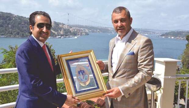 Al-Sharqi receives a token of recognition from Shakler during the Qatari business delegationu2019s visit to Turkey recently.