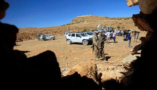 Hezbollah fighters and journalists vans are seen in Jroud Arsal, near Syria-Lebanon border, August 12, 2017