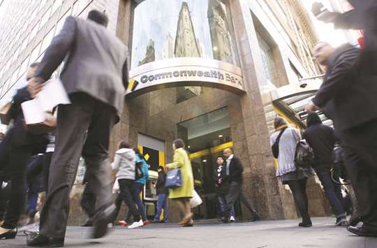Pedestrians walk past a Commonwealth Bank of Australia branch in Sydney. The financial intelligence agency AUSTRAC has accused CBA of u201cserious and systemicu201d breaches of money-laundering and counter-terrorism financing rules, alleging the countryu2019s second biggest mortgage lender failed to detect suspicious transactions nearly 54,000 times.