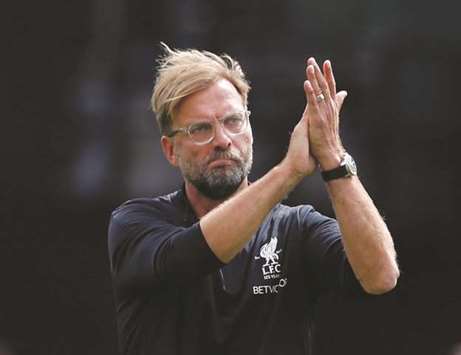 Liverpool manager Jurgen Klopp applauds the fans.