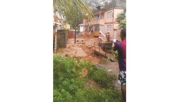 This handout picture released yesterday by Society 4 Climate Chnage Communication Sierra Leone, shows flooded streets in Regent, near Freetown.