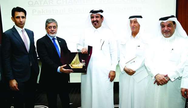 Federation of Pakistan Chambers of Commerce & Industry president Zubair F Tufail receives a token of recognition from Qatar Chamber vice-chairman Mohamed bin Towar al-Kuwari after the first Qatar-Pakistan Business Council meeting held in Doha. PICTURE: Jayaram
