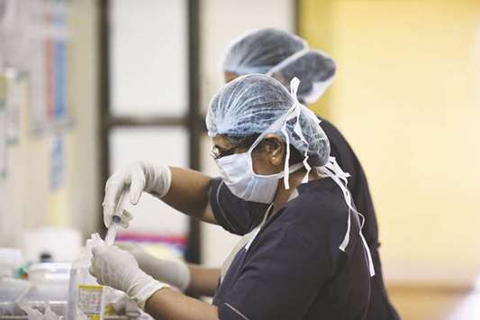 Medical staff work at the swine flu isolation ward of the Ahmedabad Civil Hospital in Ahmedabad.