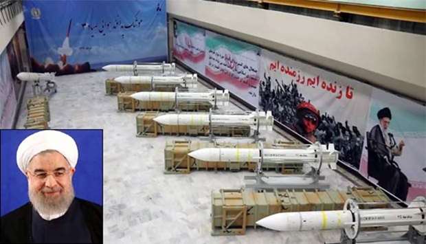 Sayyad-3 air defence missiles are on display at an undisclosed location in Iran. Inset, Hassan Rouhani