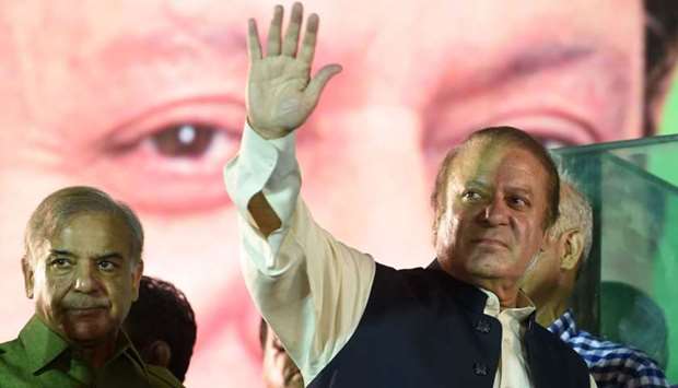Ousted Pakistani Prime Minister Nawaz Sharif gestures as he addresses supporters at a rally after reaching his home city of Lahore on August 12, 2017