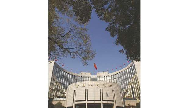 The Peopleu2019s Bank of China in Beijing. The PBoC is expected to cut the reserve requirement ratio by 50 basis points (bps) in the first quarter of 2018 to 16.5%, a Reuters poll showed.