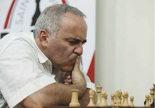 Grandmaster chess player Garry Kasparov contemplates a move as he plays grandmaster Sergey Karjakin of Russia at the Grand Chess Tour in St. Louis.