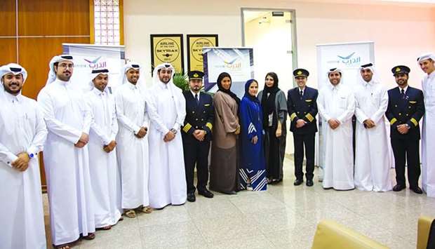 Qatar Airways personnel with participants of the open recruitment day