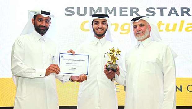 RasGas CEO awarding the RasGas Summer Internship Star 2017 winner, Mohamed al-Shereem