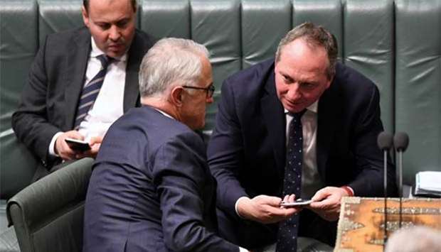 Australian Deputy Prime Minister Barnaby Joyce (right) speaks with Prime Minister Malcolm Turnbull at Parliament House in Canberra earlier this week.