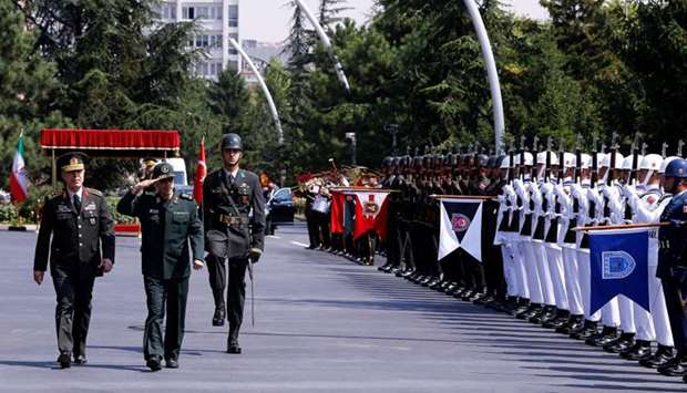 Turkish Chief of Staff General Hulusi Akar and his Iranian counterpart Major General Mohammad Baqeri review the guards of honour during a welcoming ceremony in Ankara, Turkey.