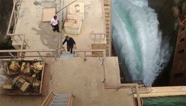 Syrian workers are seen at the Tabqa dam