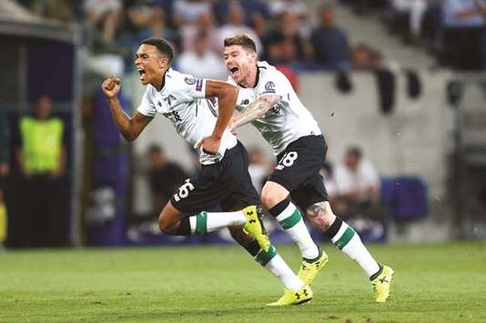 Liverpoolu2019s Trent Alexander-Arnold (left) celebrates after scoring against Hoffenheim during the Champions League play-off in Sinsheim, Germany. (Reuters)