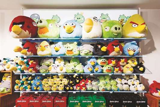 Angry Birds toy merchandise sits for sale at a store in Tampere, Finland. Angry Birds mobile games maker Rovio Entertainment, which reduced its workforce by more than half in the past three years amid slowing revenue, is now reaping the fruits of a new strategy placing more focus on in-game purchasing and advertising instead of paid downloads.