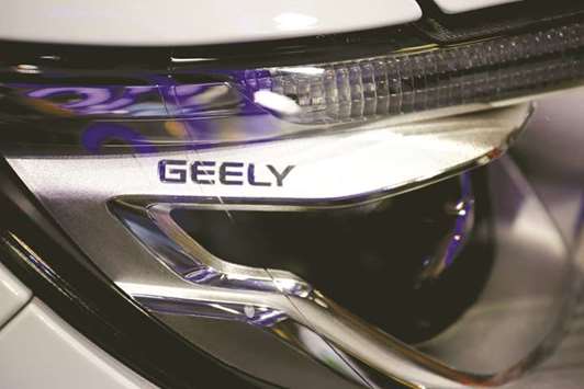 A sign is seen on a vehicle displayed at Geelyu2019s booth during the Auto China 2016 show in Beijing. Geely reported a doubling of first-half profit, above expectations, as cars designed with Swedenu2019s Volvo won over domestic consumers.