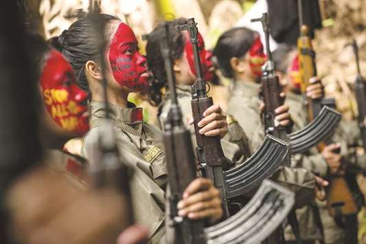 Guerrillas of the New Peopleu2019s Army (NPA) in formation in the Sierra Madre mountain range, located east of Manila.