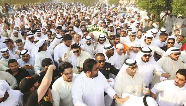 Mourners carry the coffin of Kuwaiti actor, playwright and comedian Abdulhussain Abdulredha during his funeral in Kuwait City yesterday.