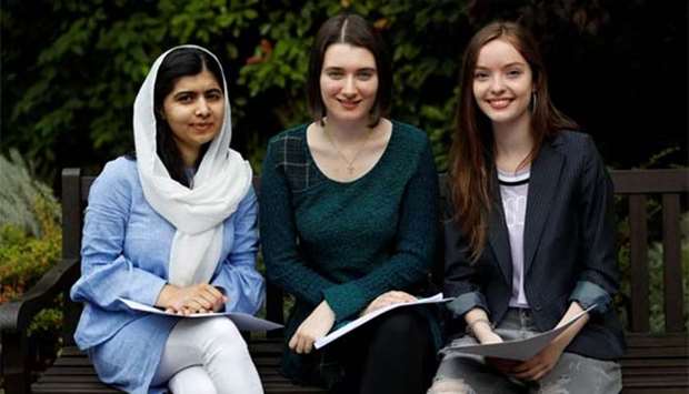 Malala Yousefzai (left) poses with fellow students Bethany Lucas (centre) and Beatrice Kessedjian after collecting her 'A' level exam results at Edgbaston High School for Girls in Birmingham on Thursday.