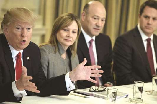 Mary Barra (2nd left), CEO of General Motors; Gary Cohn (2nd right), president of Goldman Sachs; and Doug McMillon (right), CEO of Walmart; listening while US President Donald Trump speaking before a policy and strategy forum with executives at the White House on February 3. Trump announced on Wednesday he was scrapping two business advisory councils in the wake of several high-profile resignations in protest over his comments on a white supremacist rally in Virginia that turned violent.