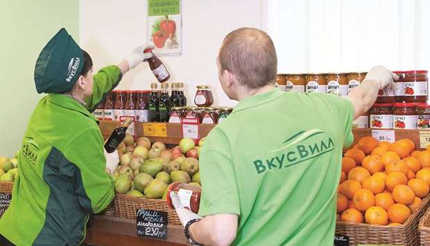 VkusVill, a Moscow grocery store chain, radiates whole-food healthfulness. The company logo is deep green, and employees wear green fleece jackets.