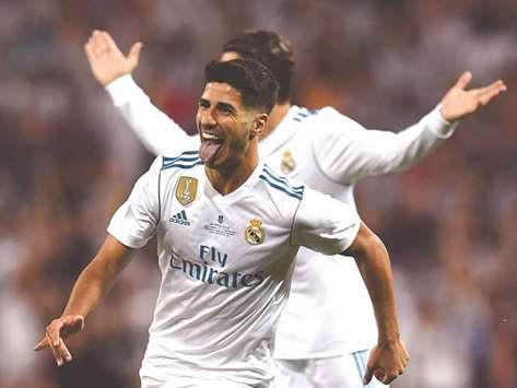 Real Madridu2019s midfielder Marco Asensio celebrates after scoring the opener during the second leg of the Spanish Supercup match.
