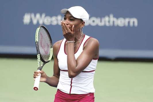 Venus Williams reacts after losing a point to Ashleigh Barty (not pictured) at Western & Southern Open in Mason, Ohio, on Wednesday. (AFP)