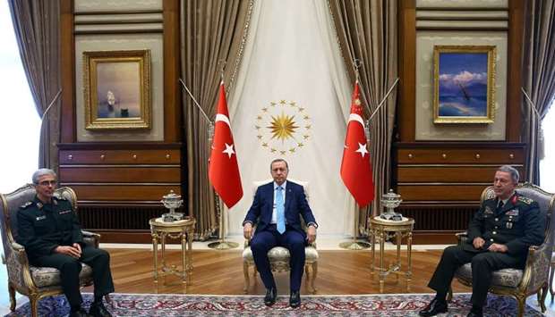 Turkey Recep Tayyip Erdogan (C) and Chief of the General Staff of the Turkish Armed Forces Hulusi Akar (R) meeting with General Staff of Iranian Armed Forces, Mohammad Bagheri (L) at the presidential complex in Ankara.