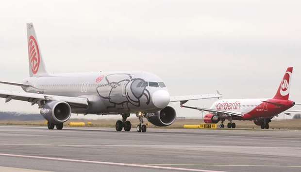 A Niki aircraft (left) taxis alongside a passenger aircraft operated by Air Berlin at Vienna International Airport. Nikiu2019s 850 employees braced for a bumpy ride as insolvent parent Air Berlin began talks yesterday to sell its assets before it runs out of cash.