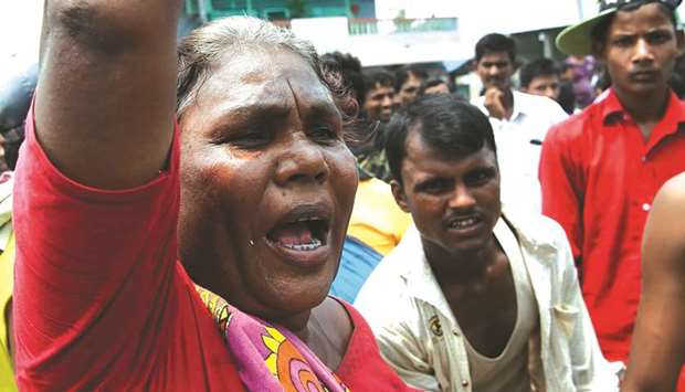 Nepali flood victims chant slogans as they demand relief material from the local government in Biratnagar.