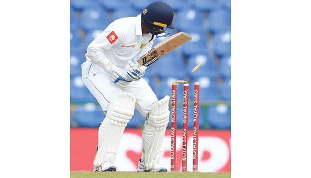 Sri Lankan cricketer Upul Tharanga being bowled by Indiau2019s Umesh Yadav (unseen)  during the third Test match at the Pallekele International Cricket Stadium on August 13.
