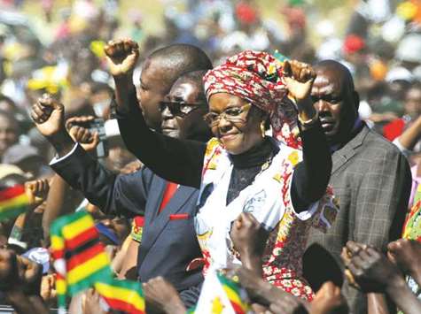This picture taken last year shows President Mugabe and his wife Grace greeting supporters of his ZANU (PF) party during a rally in Harare.