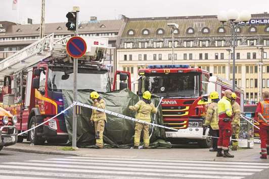 Rescue personnel cordon the area where several people were stabbed, at Turku Market Square.
