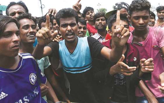 Nepali flood victims chant slogans as they demand relief material from the local government in Biratnagar.
