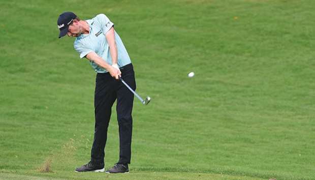 Webb Simpson plays his second shot on the 11th hole during the second round of the Wyndham Championship at Sedgefield Country Club in Greensboro, North Carolina, on Friday. (AFP)