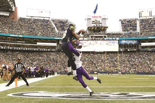 Seattle Seahawksu2019 Kasen Williams (left) catches a touchdown against Minnesota Vikingsu2019 Marcus Sherels during the first quarter of the NFL preseason game at CenturyLink Field in Seattle on Friday. (USA TODAY Sports)
