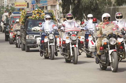 Pakistanu2019s military, naval and air force police officers escort the hearse carrying the coffin of the German-born Sister Dr Ruth Pfau, during her funeral in Karachi, yesterday.