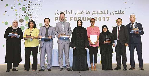 PUE president Buthaina A al-Nuaimi with the recipients of this yearu2019s forum awards.
