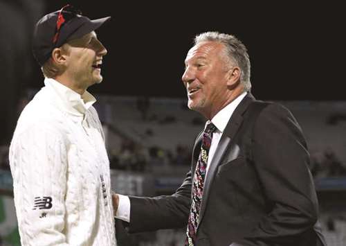 Englandu2019s Joe Root (left) and former all-rounder Ian Botham share a joke in Birmingham  on Sunday. (Reuters)